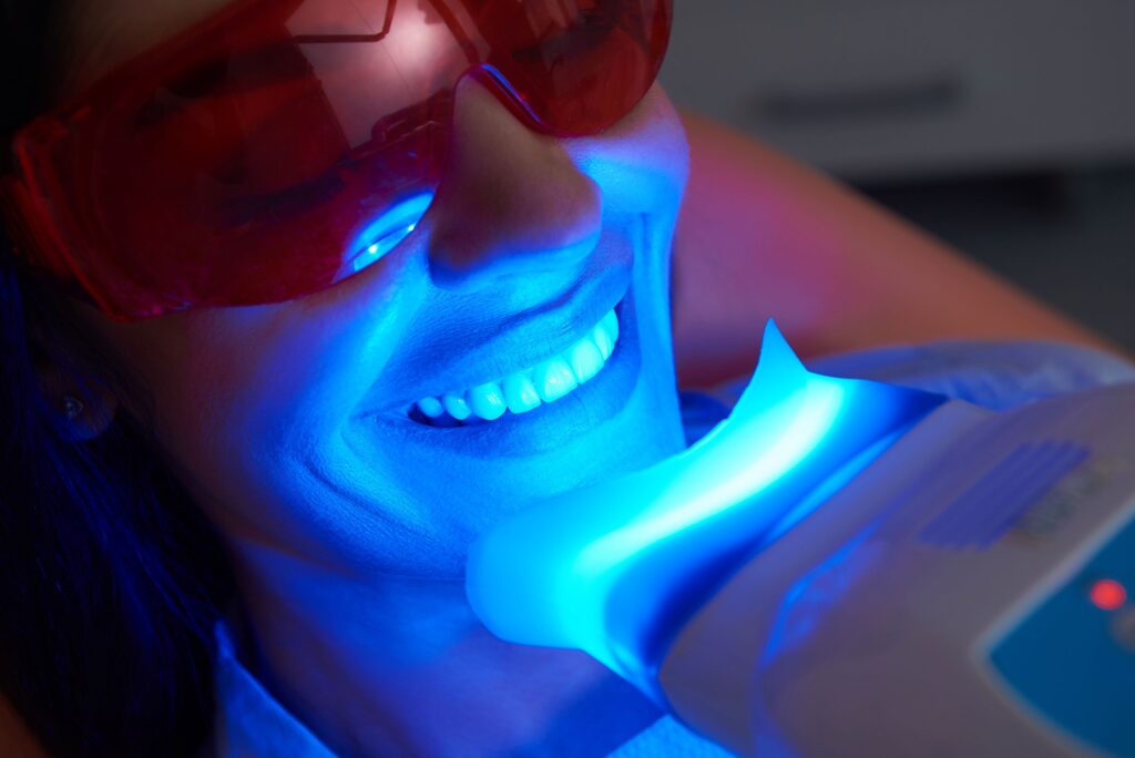 Woman undergoing in-office teeth whitening